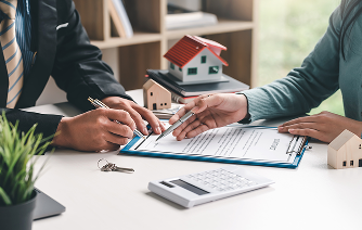 close-up-real-estate-agent-hand-pointing-document-signing-contract-house-purchase-agreement-office