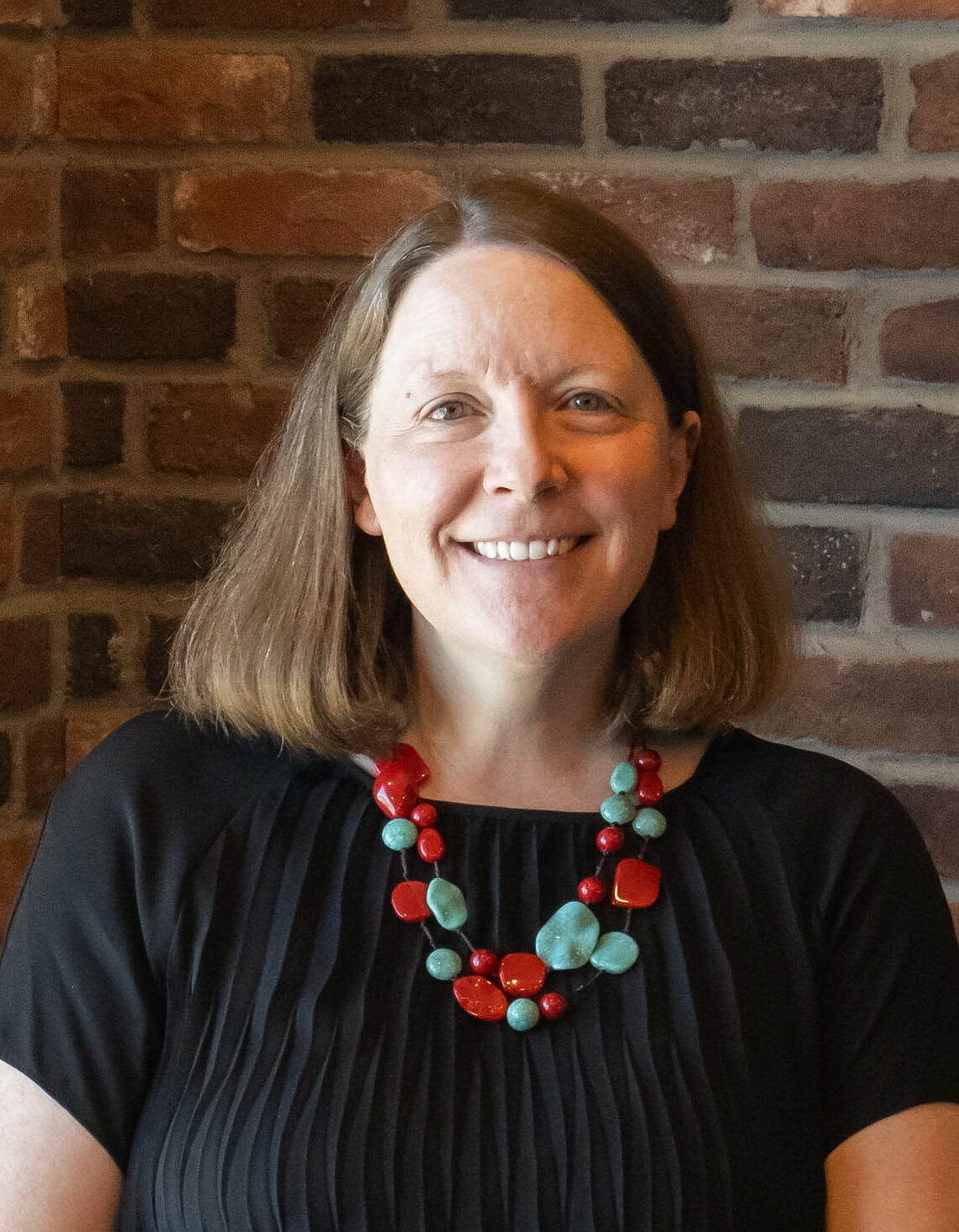 A headshot photo of Community Partner Lead Chelsea Iliff