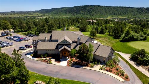 An exterior image of the Golf Club At Bear Dance restaurant in Larkspur, CO